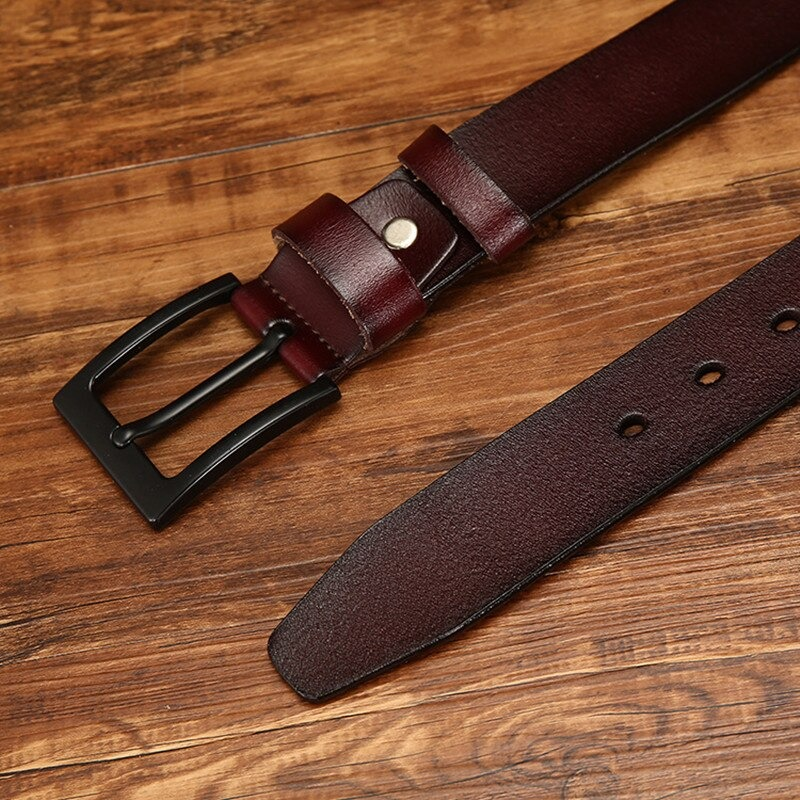 Stylish men's fashion PU leather belt with black buckle on wooden background, perfect for casual looks.