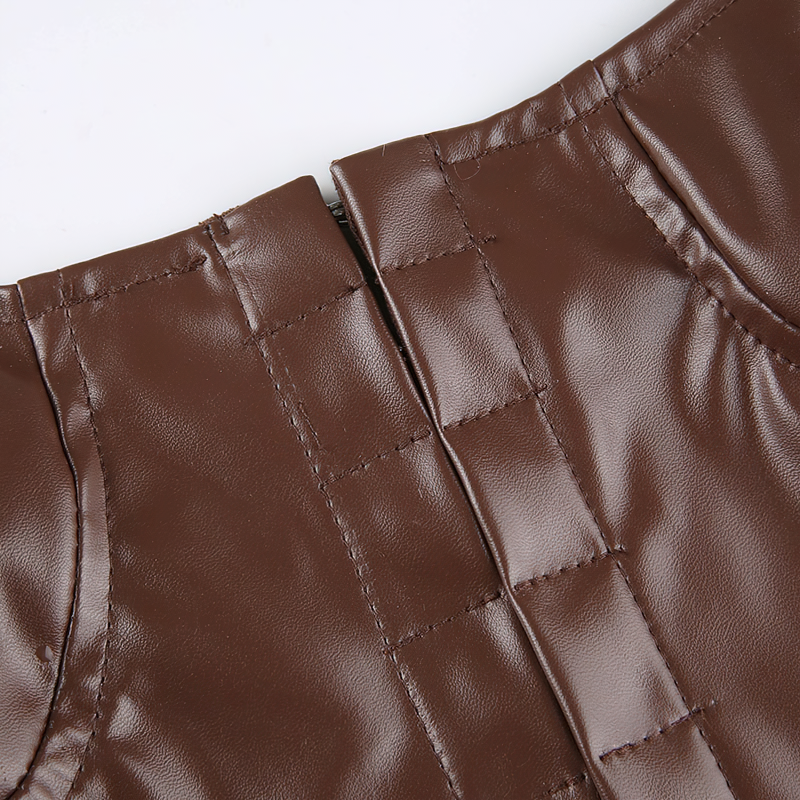 Brown PU leather sleeveless tank top detail showcasing shiny texture and button closure.