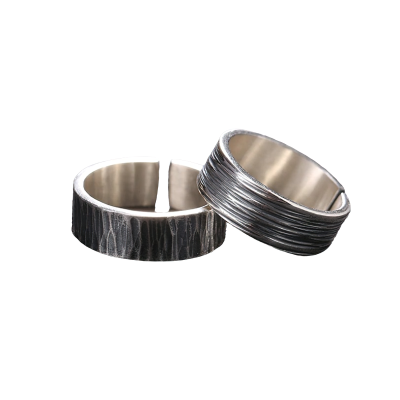 Fashion retro unisex couple rings in sterling silver for men and women, showcasing unique textures and styles.
