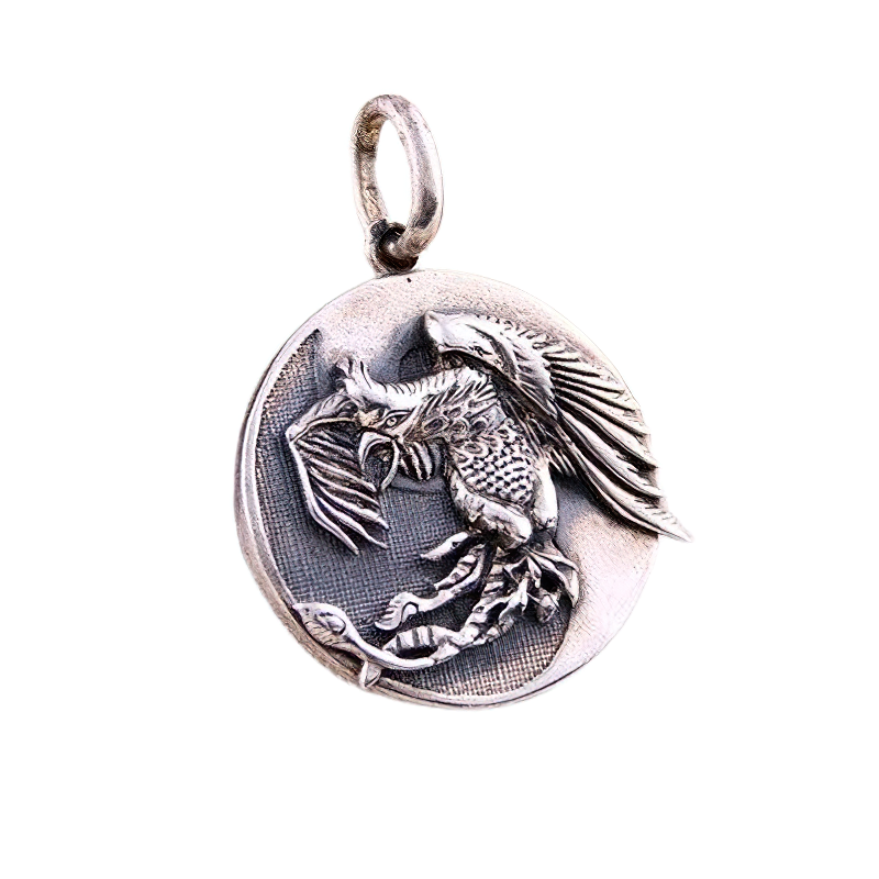 Sterling silver pendant featuring a beautifully detailed bird emblem, perfect for retro unisex fashion.