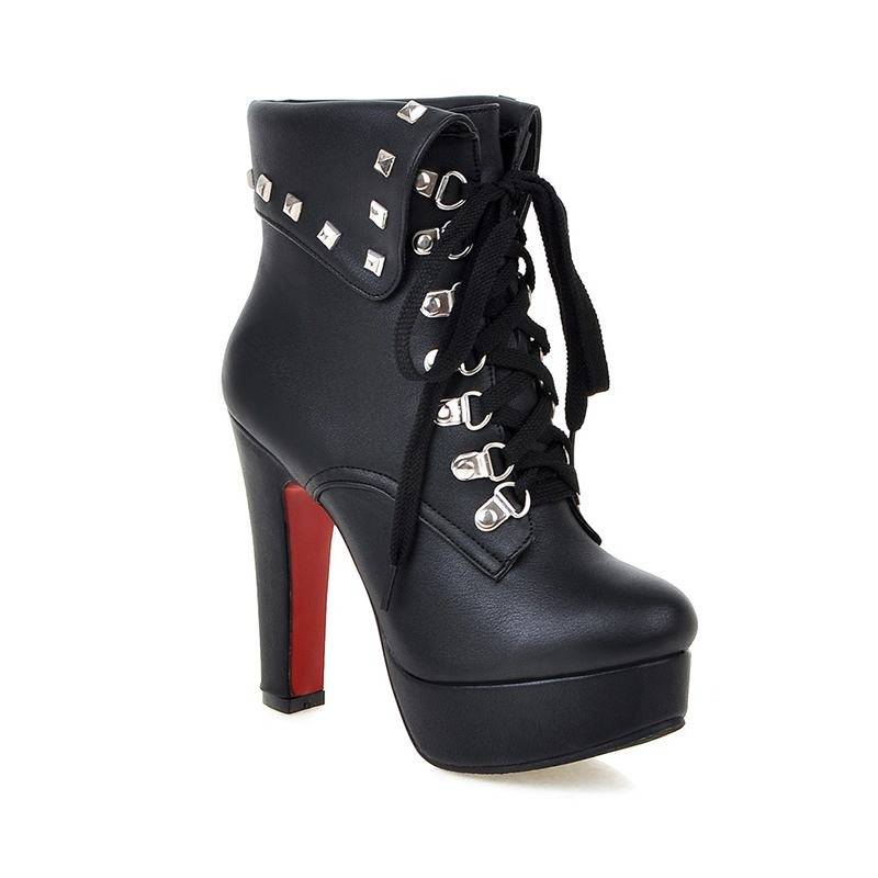 Fashion punk lace-up ankle boots with high thick heels and silver rivets in black PU leather.