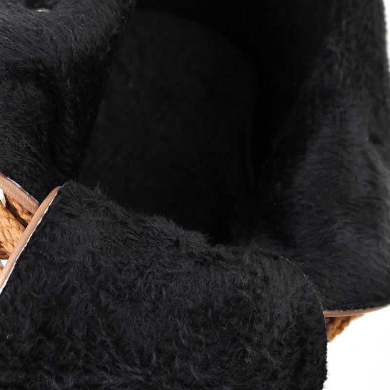 Interior view of soft black fur-lined boot with cozy texture and stylish detailing.