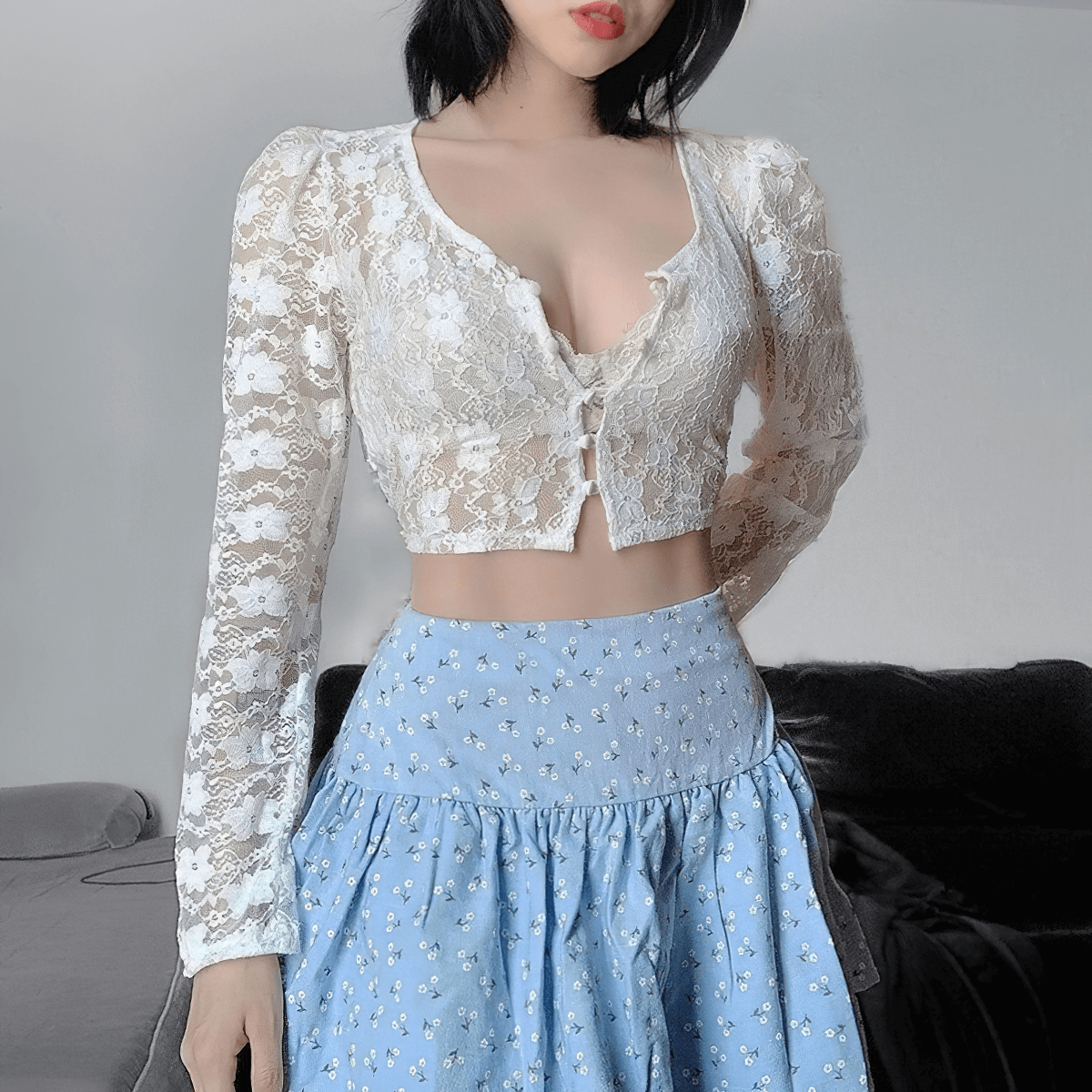 Fashionable women's gothic lace crop top with long sleeves, showcasing a luxurious and stylish look.
