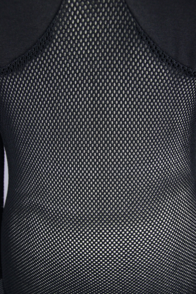 Close-up of a women's black mesh top showing the stylish mesh texture and gothic design.