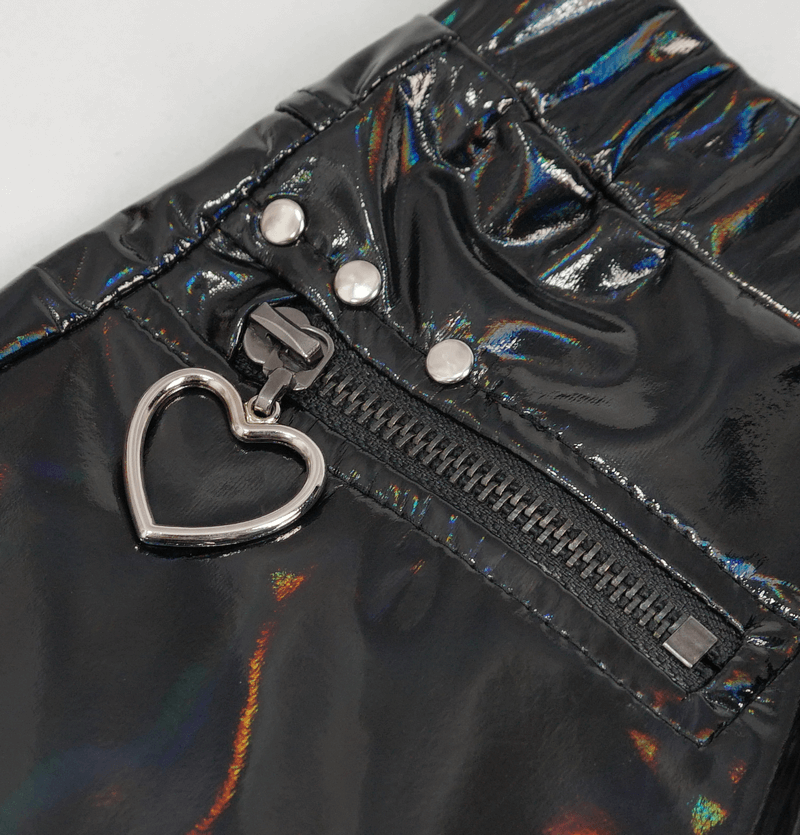 Close-up of zipper detail on women's fashion slim PU leather pants with heart charm.