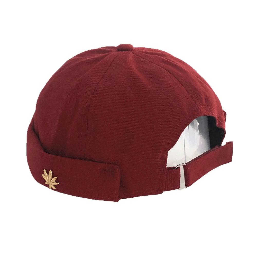 Stylish adjustable brimless cotton cap in burgundy with leaf rivet detailing for alternative fashion lovers.