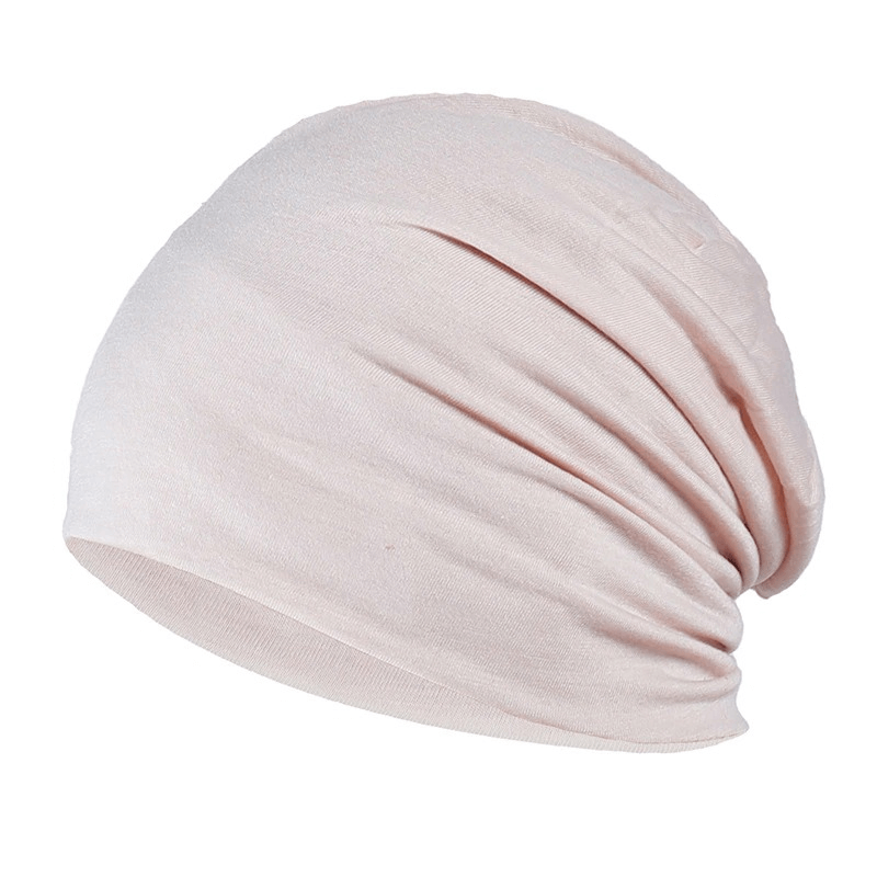 Soft pink unisex stretch beanie hat made of cotton, perfect for casual style and comfort for men and women.