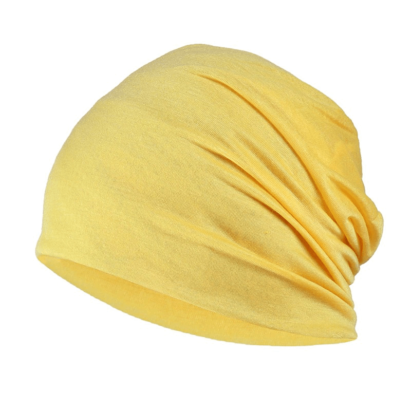 Fashion solid stretch beanie hat in vibrant yellow, soft cotton, unisex design for casual style and warmth.