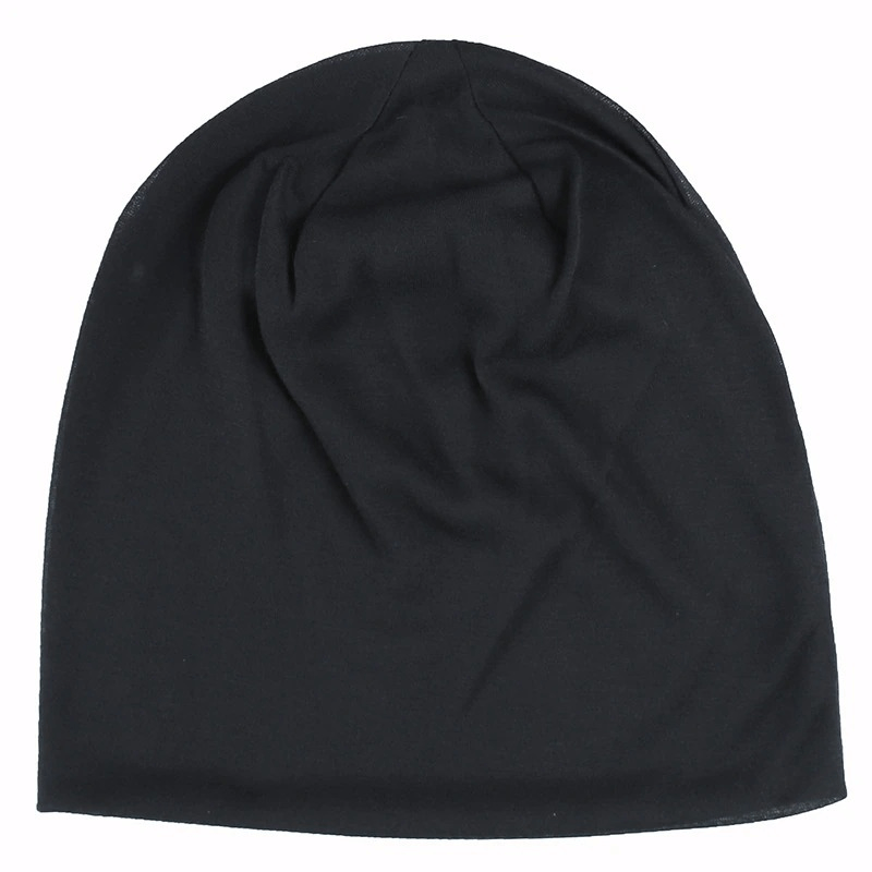 Fashion solid stretch beanie hat in black, unisex soft warm cotton beanie for men and women, casual accessory.