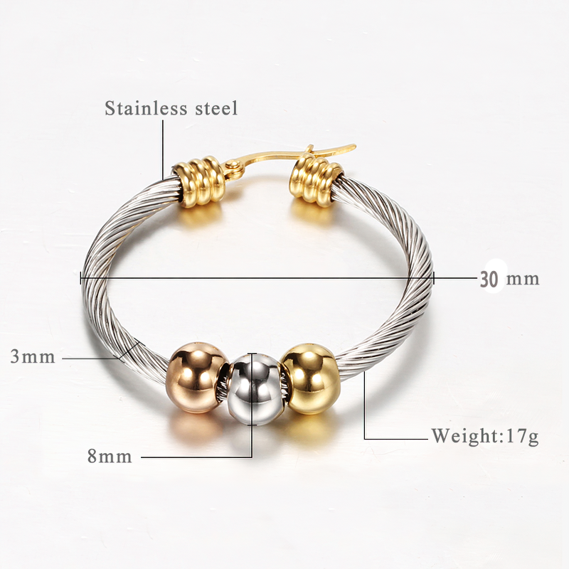 Elegant stainless steel earrings in silver color with shiny twisted surface, perfect accessory for women's fashion.