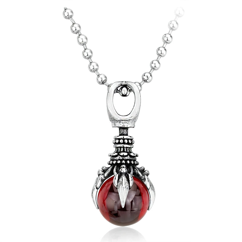 Unisex stainless steel claw pendant with red stone, an alternative fashion necklace for a unique style.