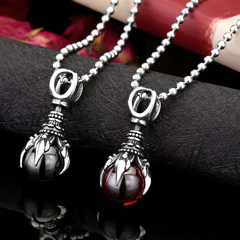 Fashion stainless steel pendant with claw stone design, available in red and black colors, unisex alternative style necklace.