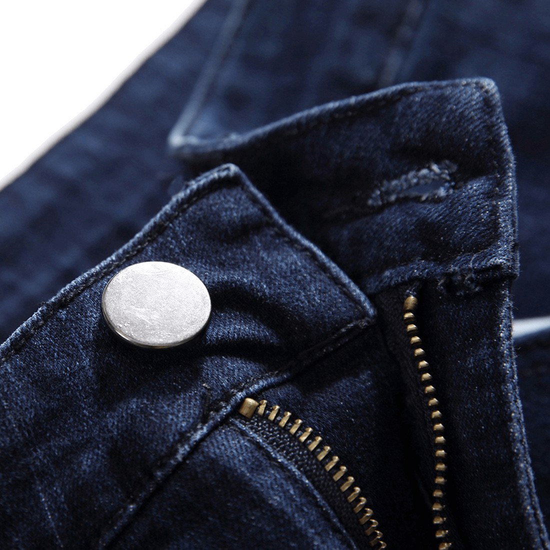 Close-up of dark denim jeans featuring button and zipper details for stylish punk outfits.