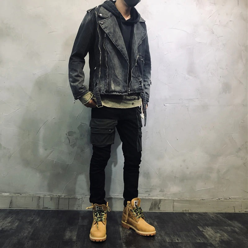 Fashion streetwear denim jacket in rock style, worn with cargo pants and boots against a modern backdrop.