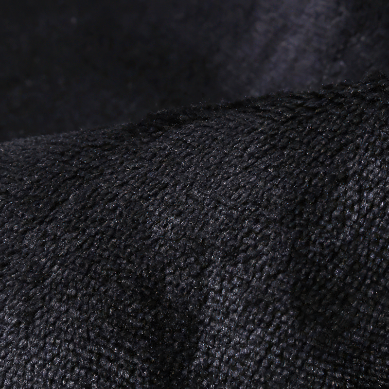 Close-up of luxurious black suede fabric, perfect for a men's steampunk slim vest.