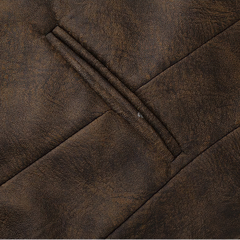 Close-up of luxurious brown suede fabric showcasing intricate detailing of a men's steampunk vest.