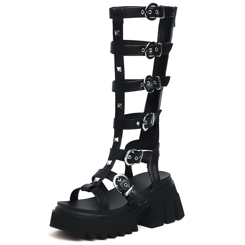 Chic black high platform sandals with gladiator straps and metal accents, perfect for summer fashion.