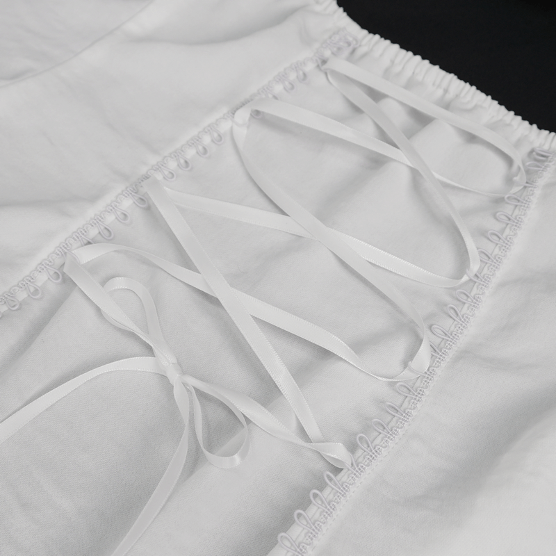 Close-up of white sleeveless blouse lace-up back detail, showcasing gothic style with elegant ribbons.