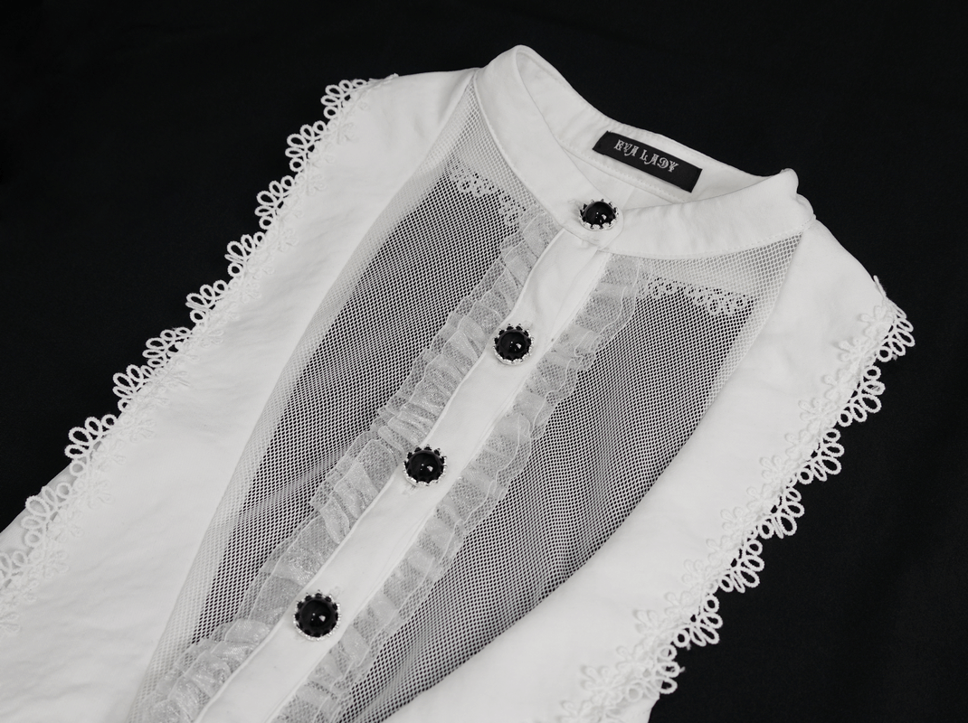 Stylish white sleeveless blouse with lace detailing and mesh panel, perfect for a gothic chic look.