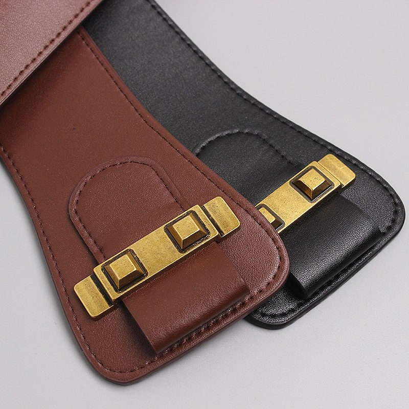 Fashionable leather belts in brown and black with big gold color pin buckles, perfect for accentuating the waist.