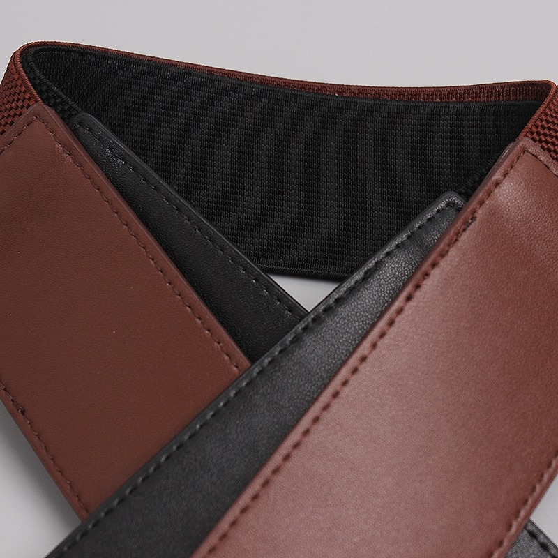 Fashion wide genuine leather belt for women, featuring a stylish design in brown and black.