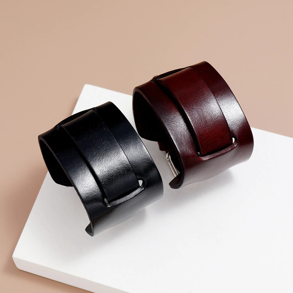 Fashion wide genuine leather bracelet set in black and brown, adjustable vintage punk cuff wristbands displayed elegantly.