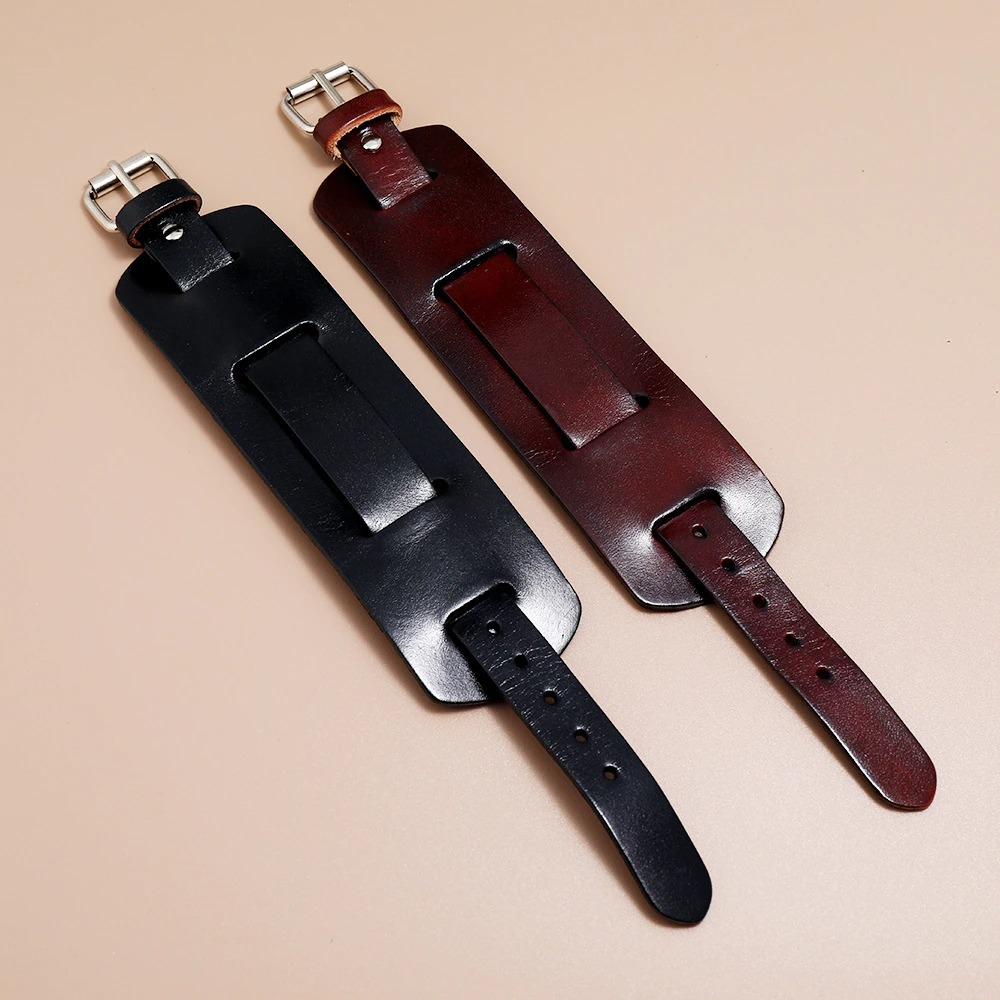 Fashionable wide genuine leather bracelets in black and brown, showcasing adjustable punk cuff design.