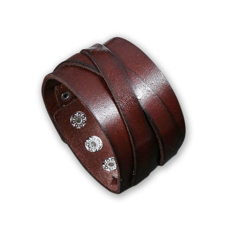 Unisex punk-style wide leather bracelet in dark brown with stylish metal studs, perfect for any outfit.