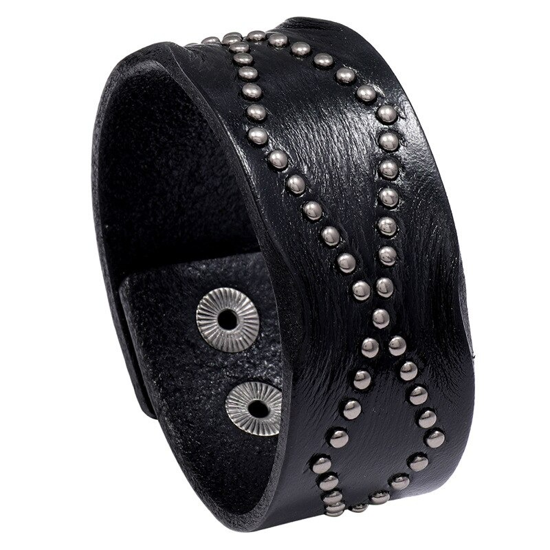 Wide black leather bracelet with silver rivets in a punk rock style, perfect for stylish unisex outfits.