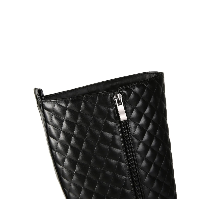 Close-up of stylish black PU leather knee-high boots with quilted design and zipper detail for women.