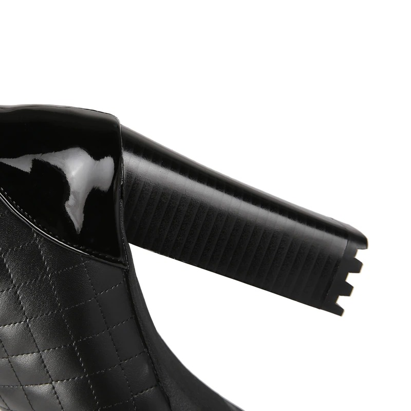 Close-up of stylish PU leather black high heel with textured pattern, perfect for casual fashion looks.
