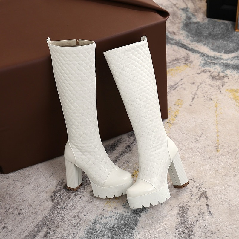 Stylish white knee-high platform boots made of PU leather with a trendy quilted design for women.