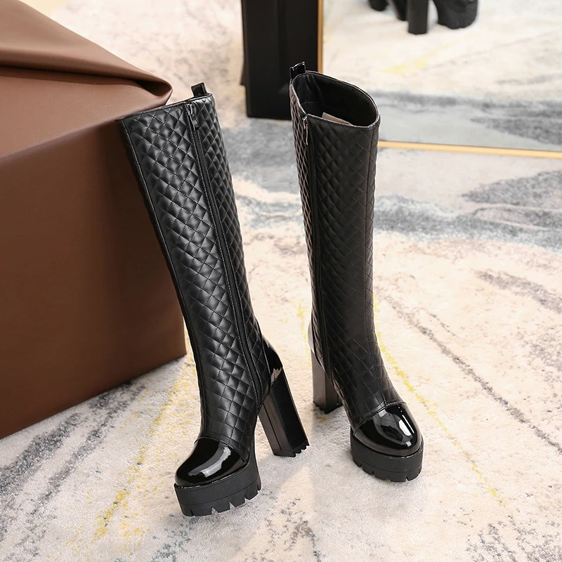Stylish women's high heel knee high boots in black PU leather with a trendy quilted design and platform sole.