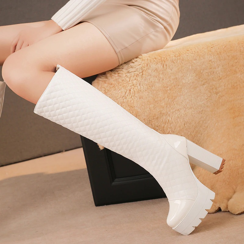 Stylish white knee-high boots made of PU leather with high heels, perfect for casual occasions and elevating your look.