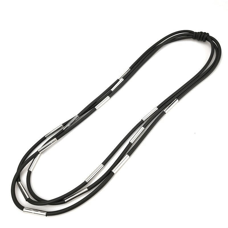 Fashionable women's handmade black rubber necklace with silver accents in gothic style.