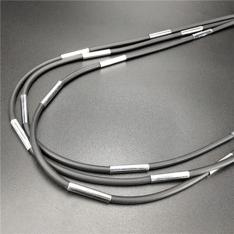 Stylish handmade black rubber necklace with metallic accents for gothic fashion lovers.