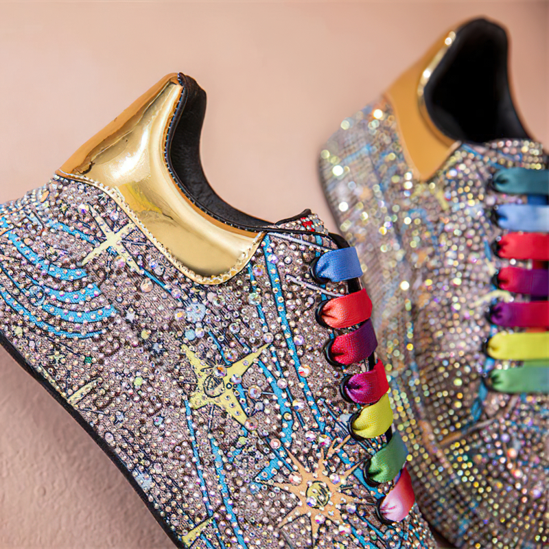 Colorful women's platform sneakers with shiny rhinestones and metallic accents, perfect for a fashionable look.