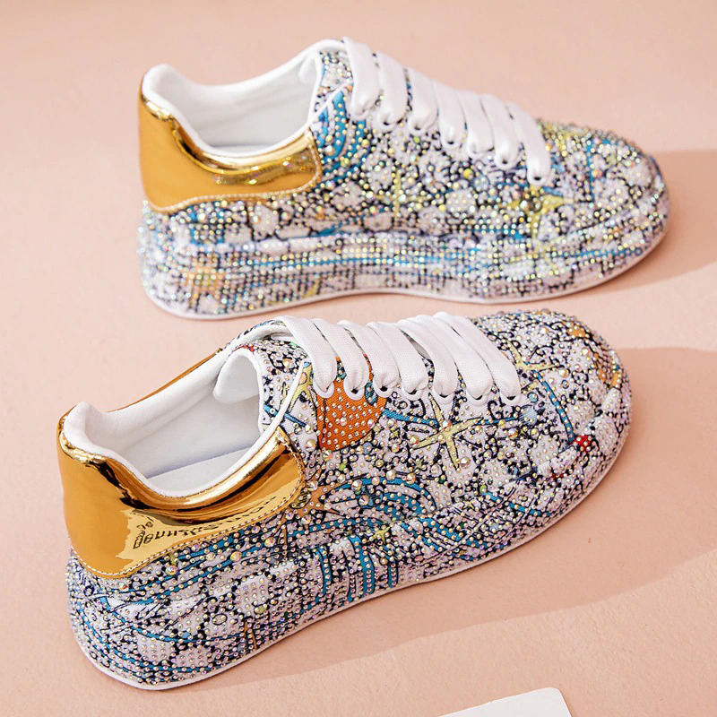 Stylish women's platform sneakers with rhinestones and shiny golden accents. Perfect for a bold fashion statement!