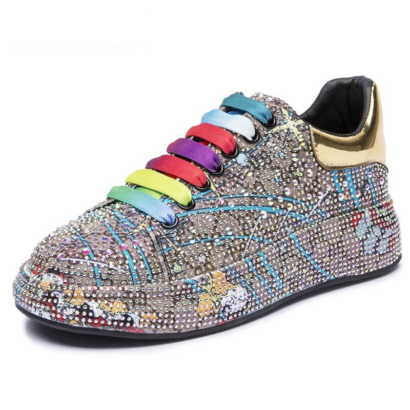 Sparkling women's platform sneakers adorned with colorful rhinestones and vibrant laces, perfect for stylish comfort.