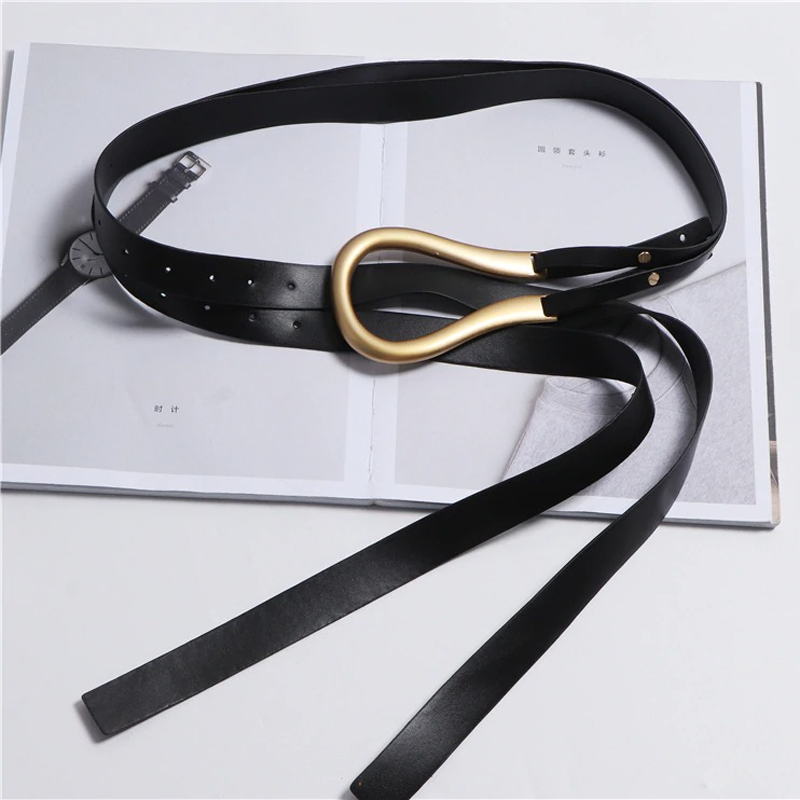 Fashionable PU leather belt with a striking gold buckle, perfect for versatile outfit styling.
