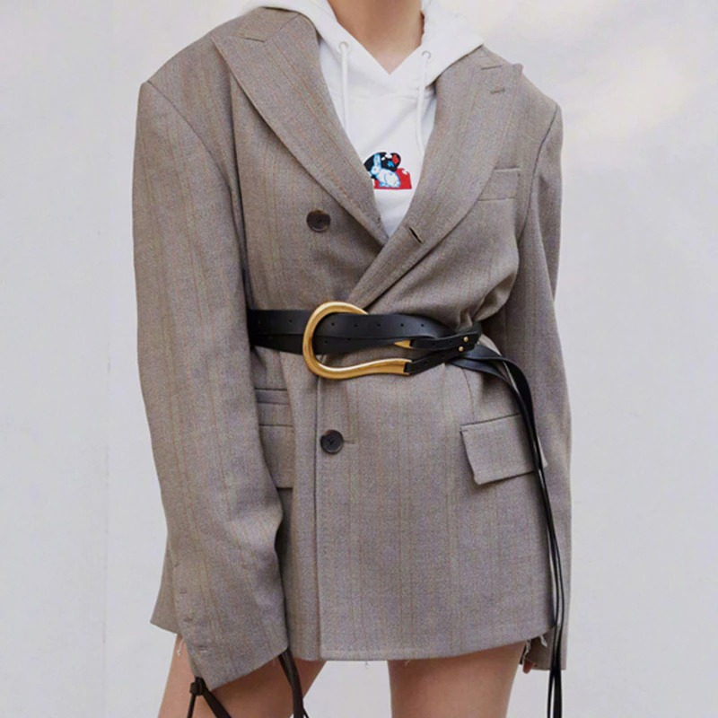 Trendy women's blazer styled with a black PU leather belt featuring a bold gold buckle for a chic look.