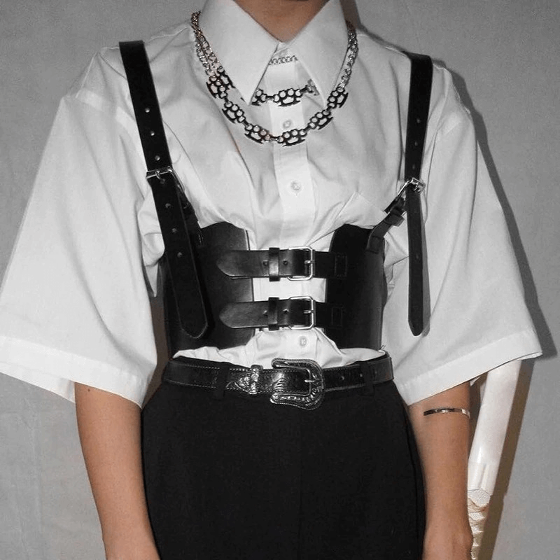 Women's black PU leather corset belt in punk style with buckle details, enhancing a white shirt and black pants ensemble.