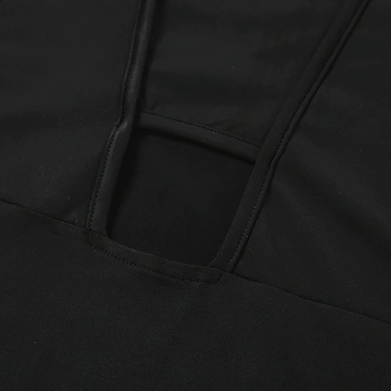 Close-up of the stylish black sleeveless jumpsuit showcasing its sleek neckline and quality fabric detail.