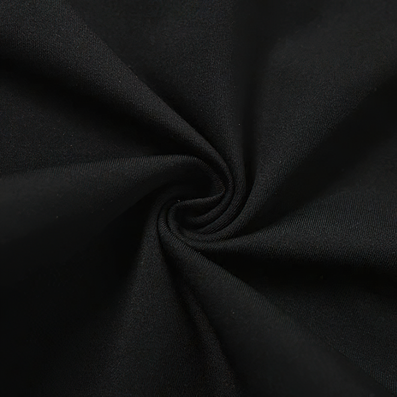 Close-up of soft black fabric, highlighting the quality material of a women's sleeveless jumpsuit.