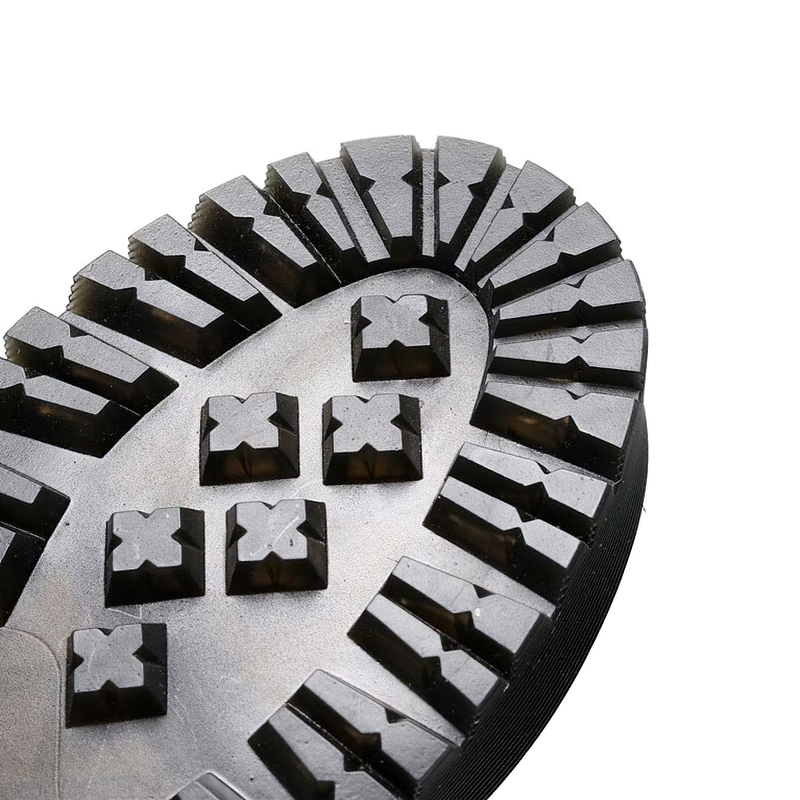 Close-up of the rugged sole of stylish women's boots, featuring textured grip for comfort and stability.