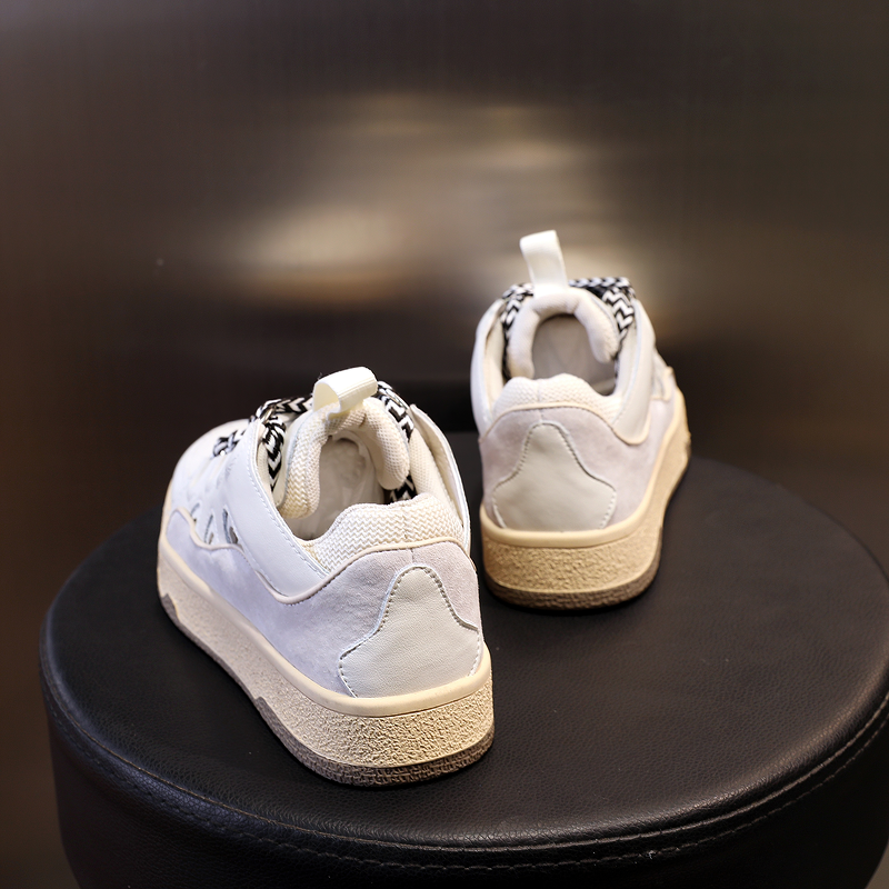 Back view of stylish women's chunky platform sneakers in white with trendy mixed color design.