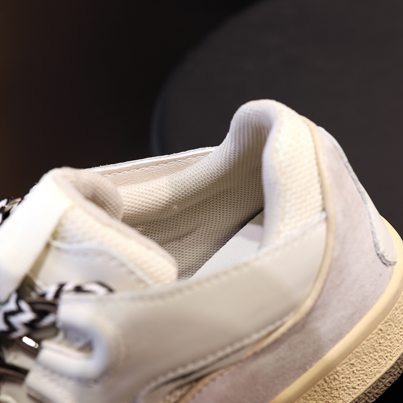 Detail view of a comfortable women's chunky platform sneaker with soft interior cushioning.