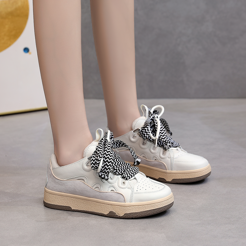 Fashion women's chunky platform sneakers in mixed colors with stylish black and white laces, perfect for retro outfits.