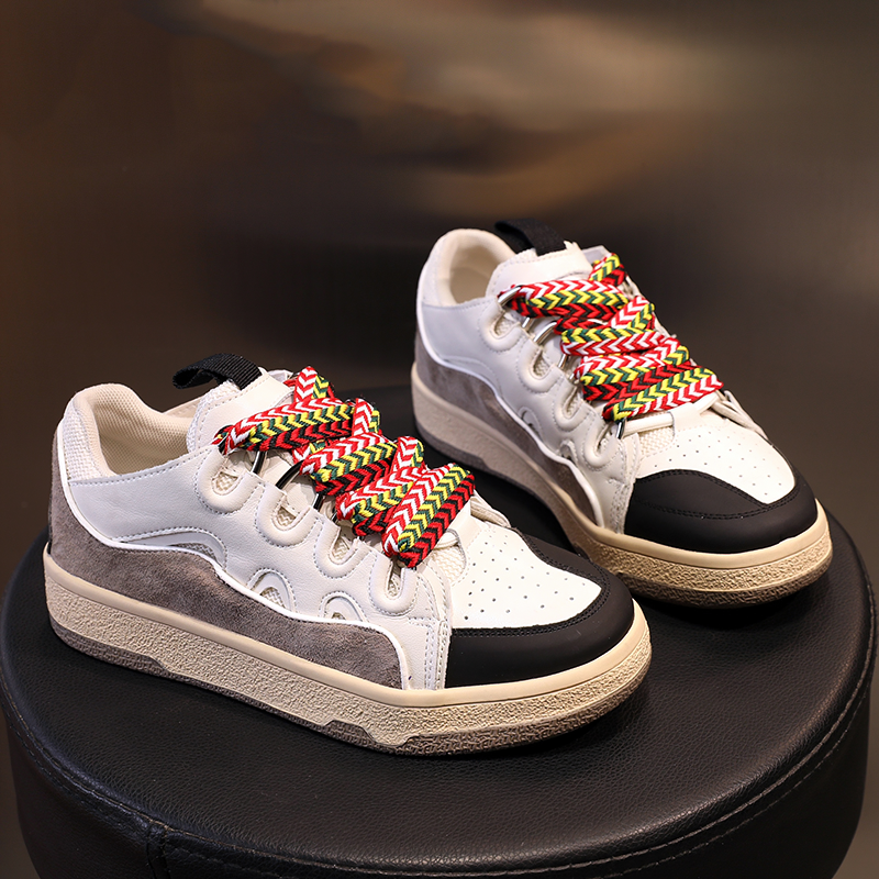 Fashion women's chunky platform sneakers with colorful laces, retro style, genuine leather, perfect for trendy outfits.