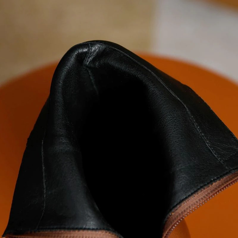 Inside view of women's genuine leather high heel ankle boots showcasing the quality craftsmanship and multicolour design.
